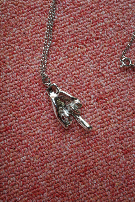 70s silver middle finger necklace