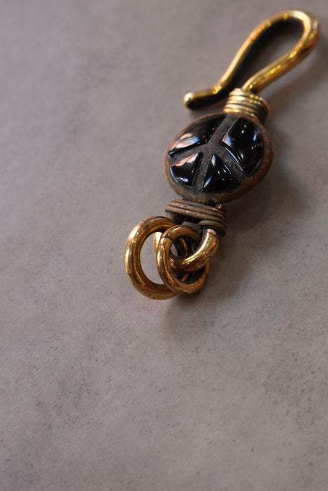 handmade brass key chain "peace" black