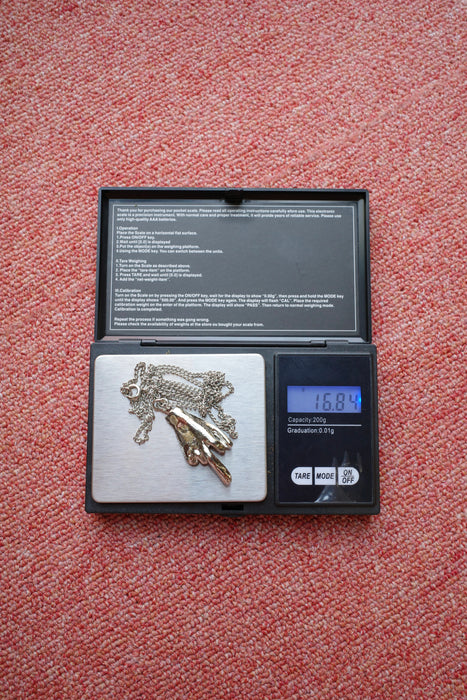 70s silver middle finger necklace