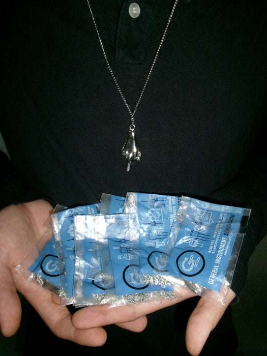 70s silver middle finger necklace